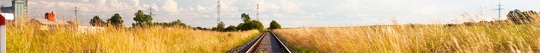 railroad in the middle of the field